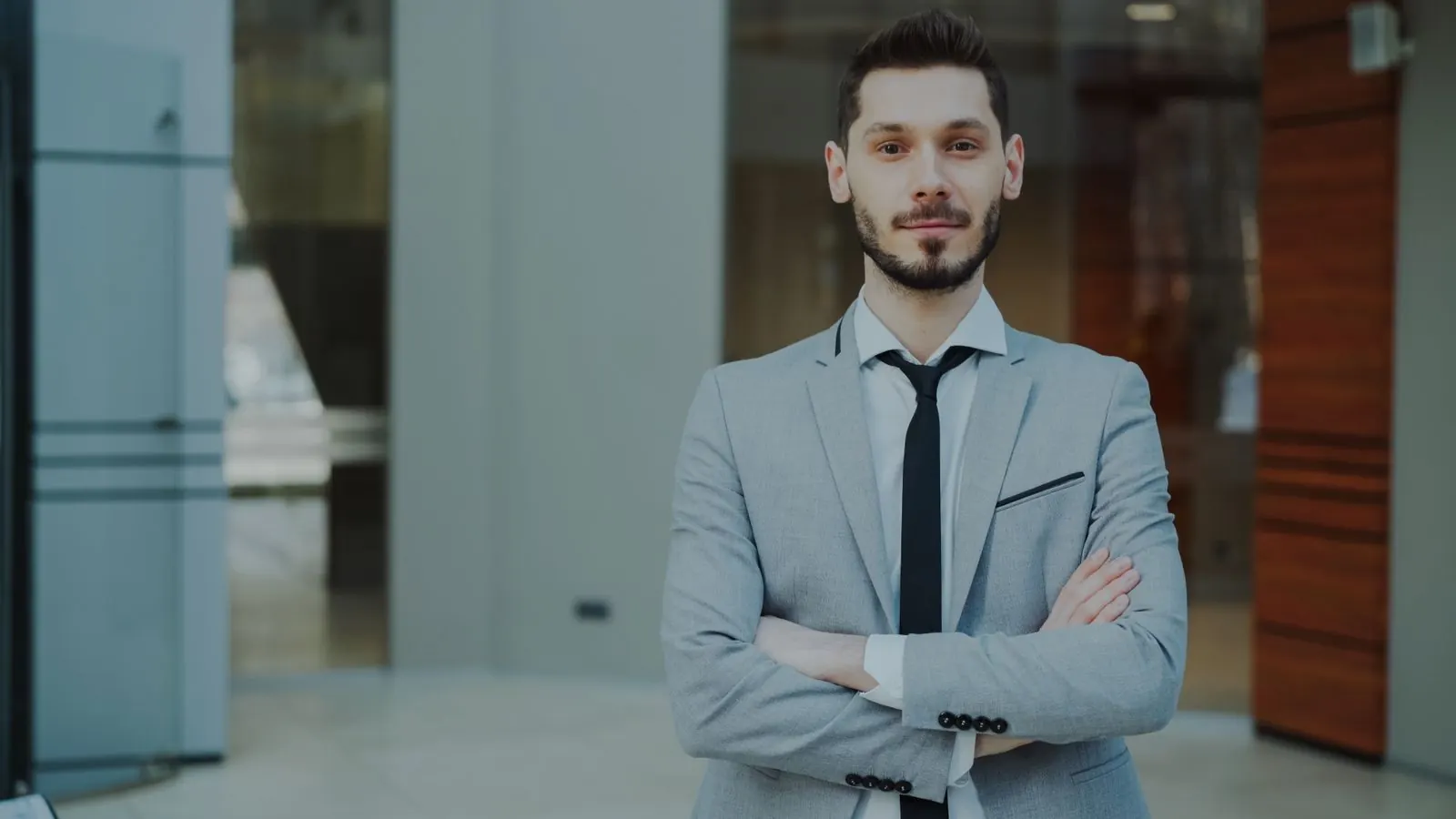 A bilingual account manager in the lobby of a modern office