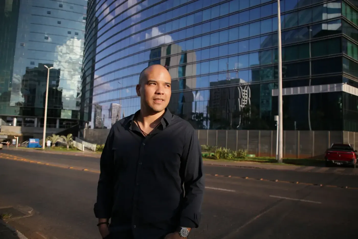 A real estate support professional outside a commercial building