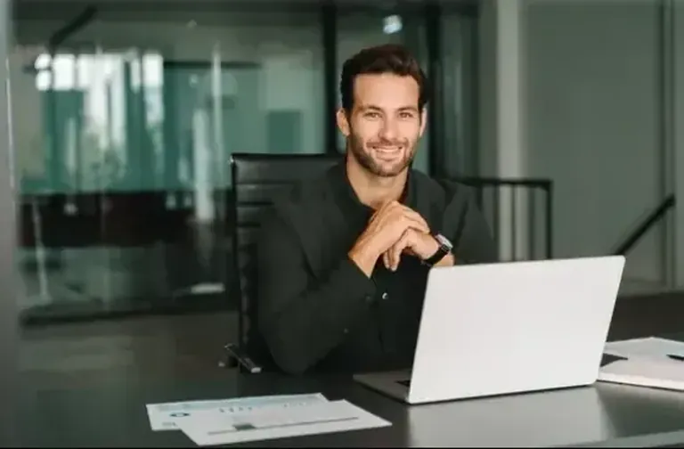 An account manager at his desk, ready for the call